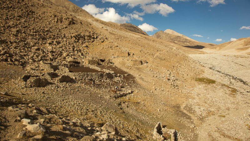 The outline of goat pens built from rocks in a Wakhan valley.